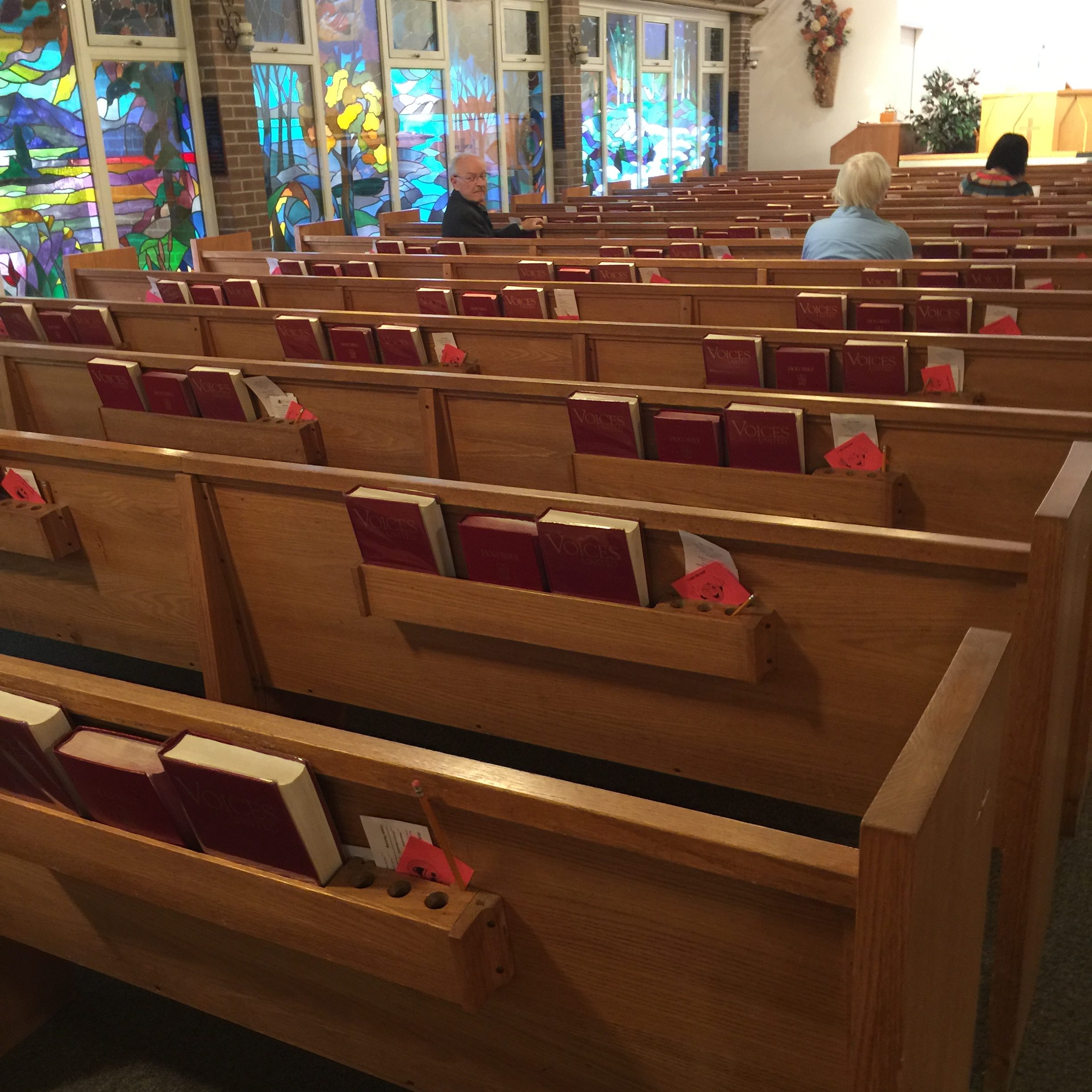 church pews and stained glass windows
