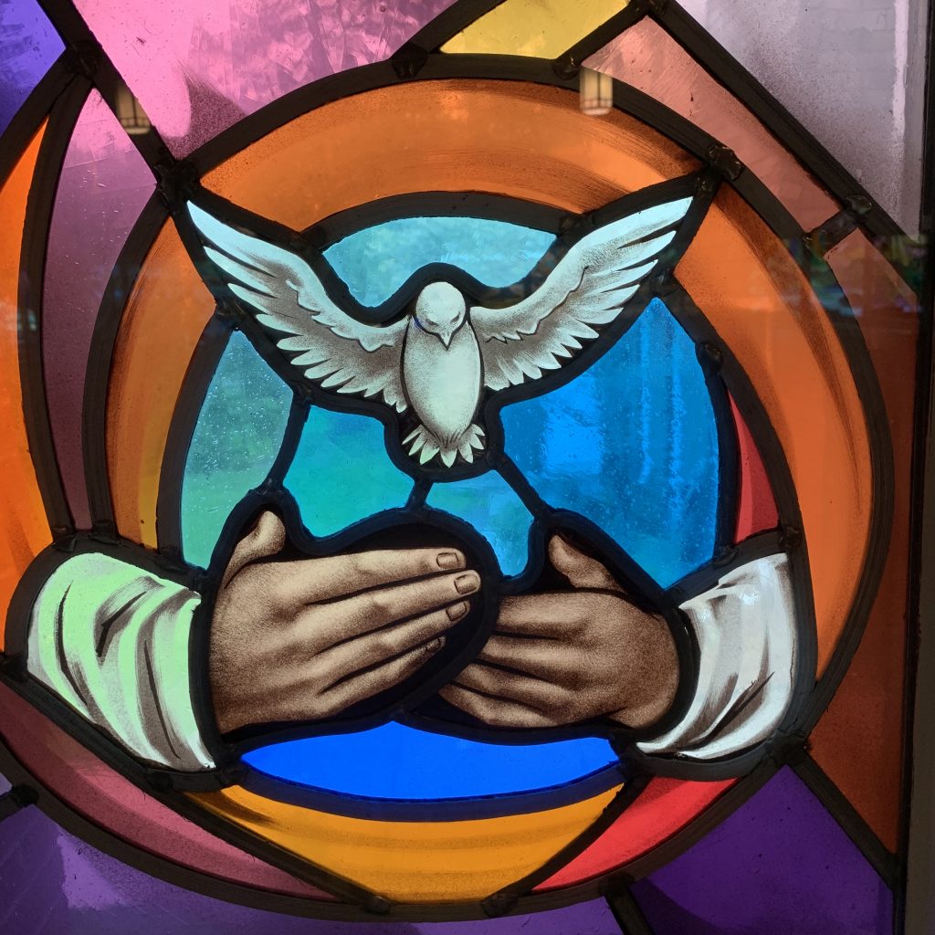 Hands releasing the Holy Spirit - a white dove